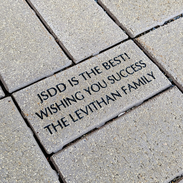 A brick saying JSDD is the best! Wishing you success. The Levithan family.