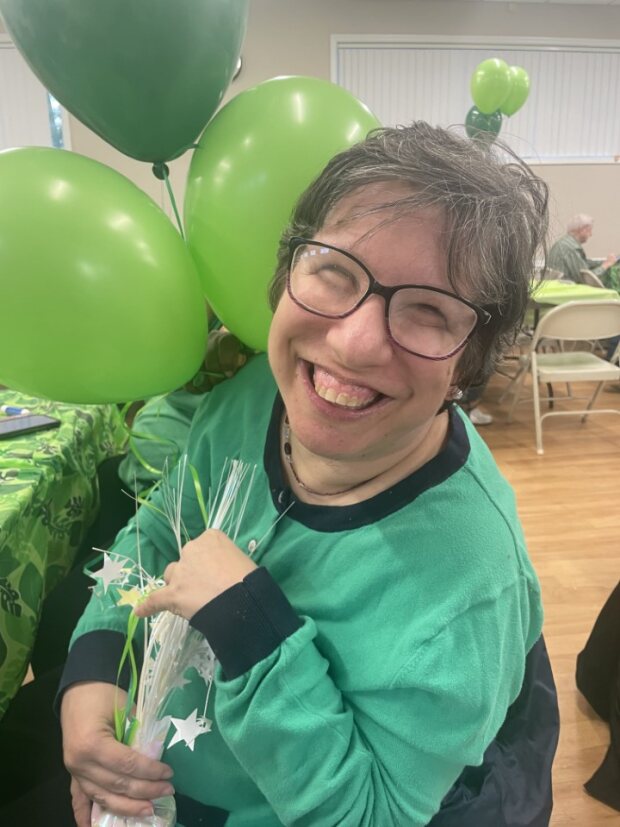 Alicia smiling with balloons