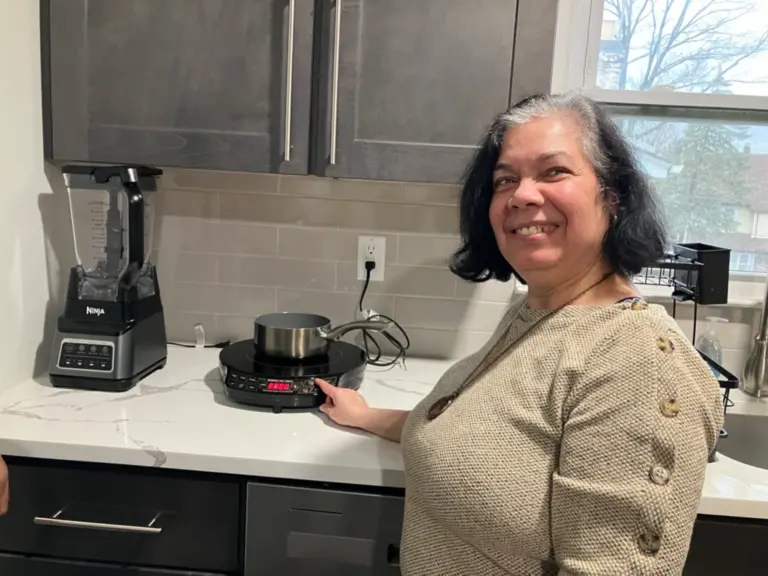 Maria using a Cooktop