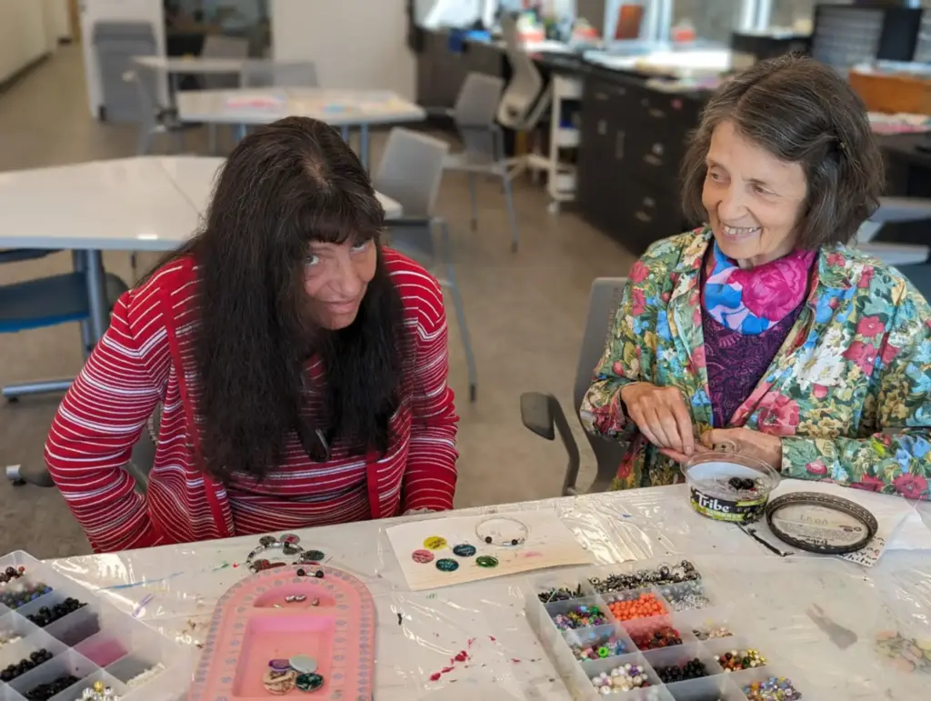 Judy and Esther with two paint palettes