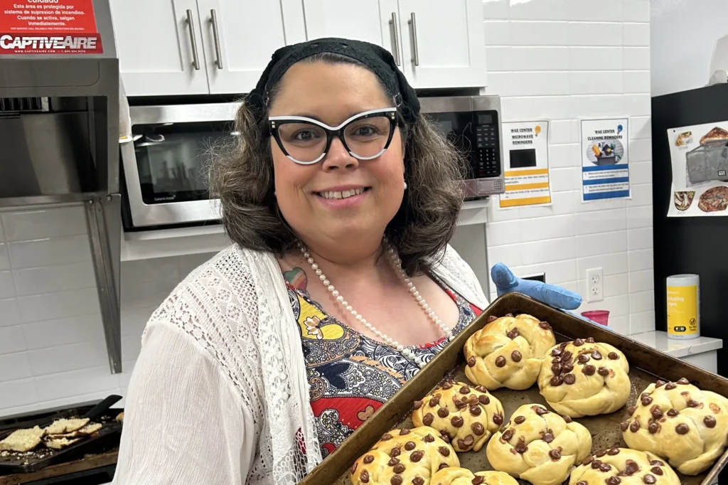 Jaimie Rai holding freshly baked cookies