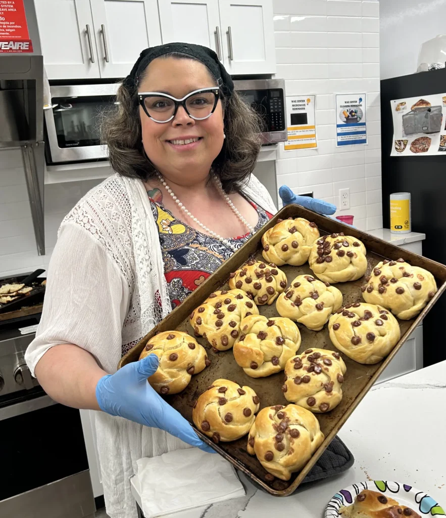 Jaimie Rai holding freshly baked cookies